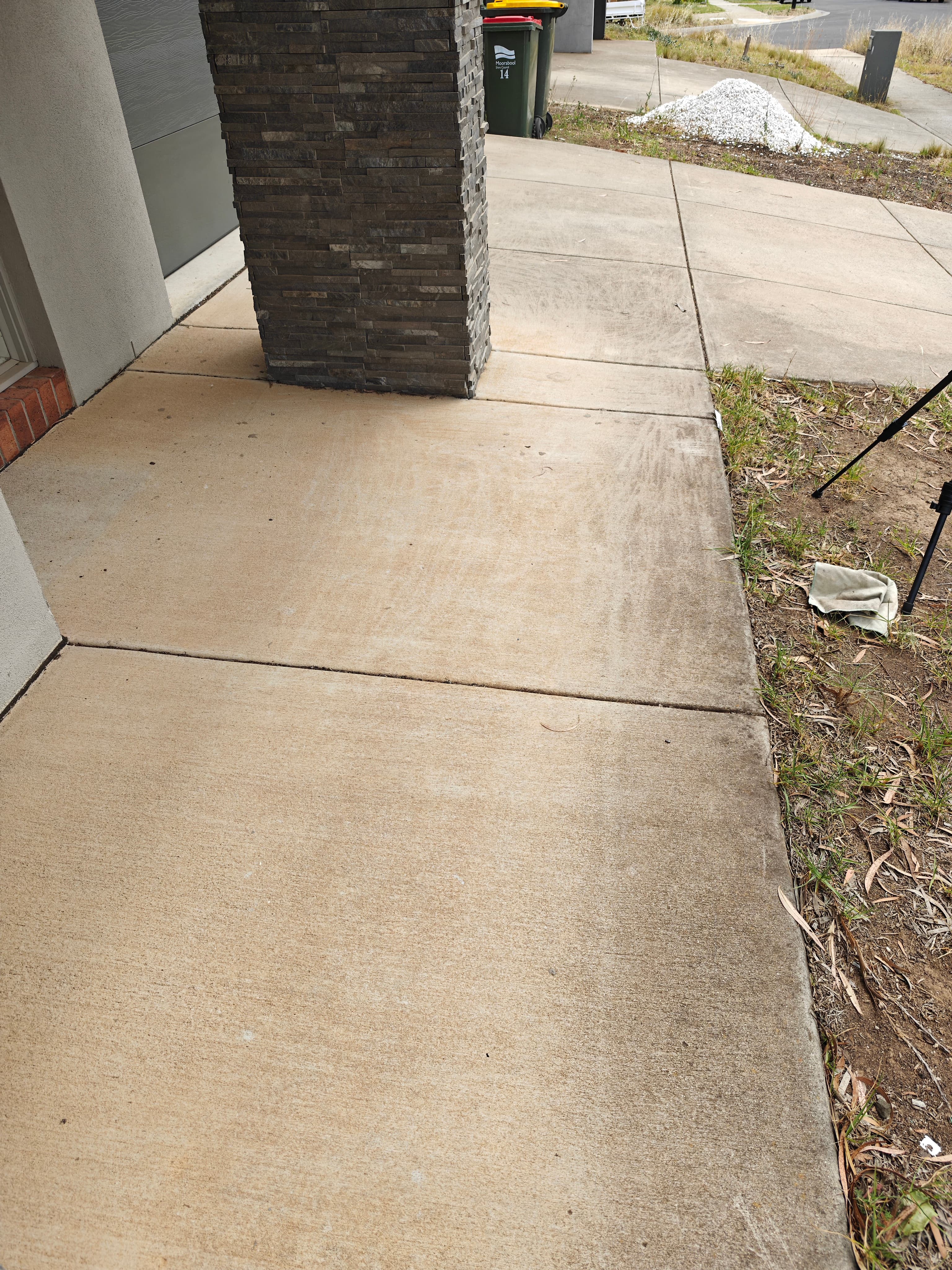 Front door concrete before pressure washing