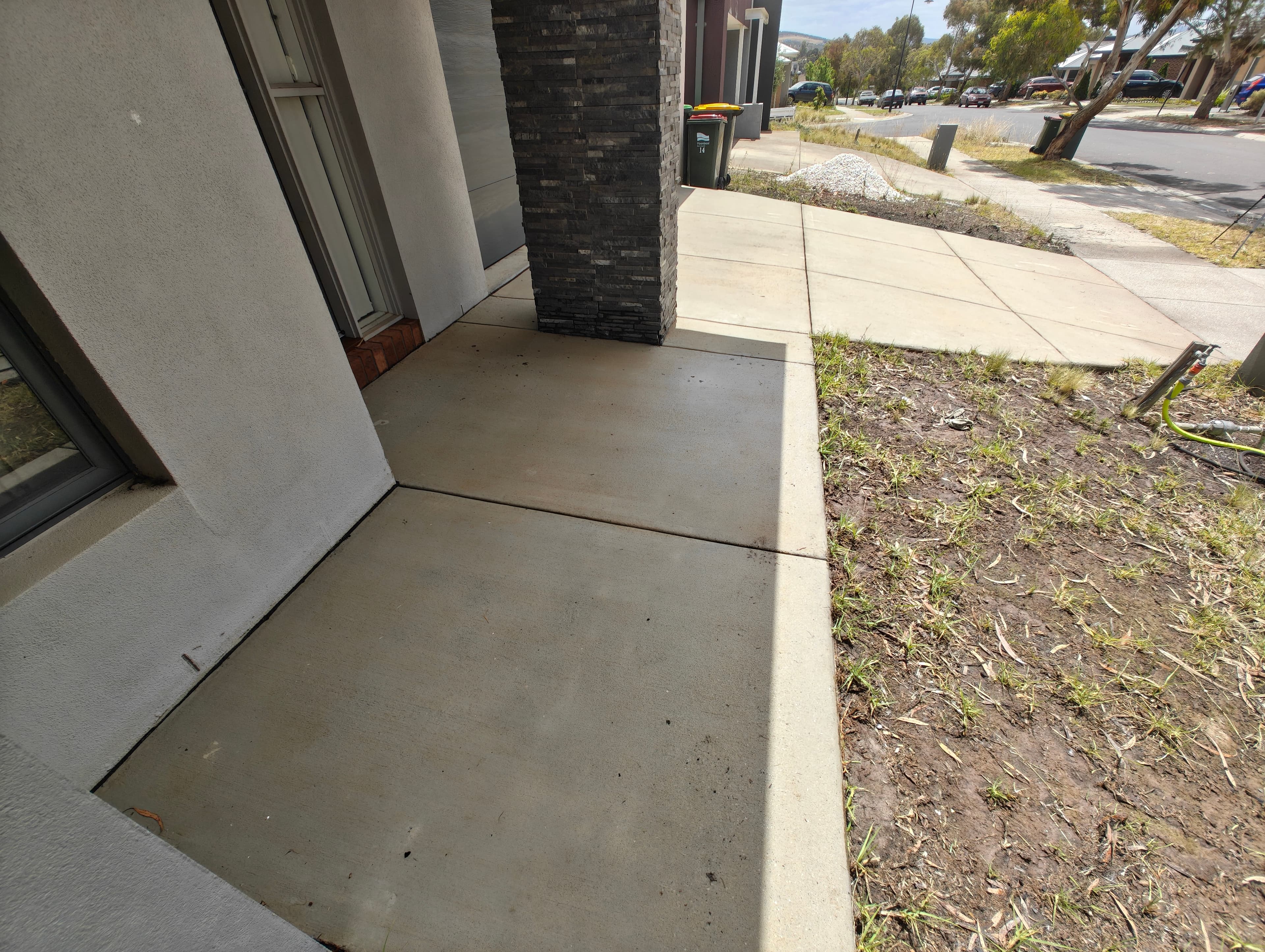 Front door concrete after pressure washing